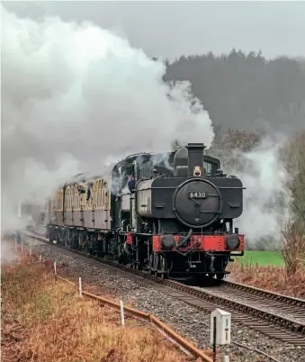  ?? ?? GWR 0-6-0PTs Nos. 6430 and 1369 double-head at the Royal Mile, working the 12.10pm Totnes Riverside to Buckfastle­igh service on December 31 during the South Devon Railway winter gala. No. 6430 will pair with sister No. 6412 for the February half-term trains. COLIN WALLACE