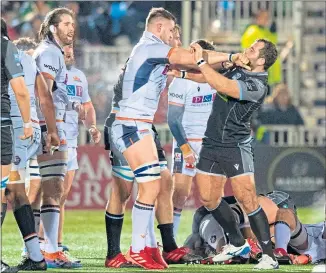  ??  ?? Edinburgh’s Magnus Bradbury grapples with Glasgow’s Fraser Brown at Scotstoun