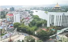  ??  ?? Photo shows a view of Kuching. Sarawak’s extensive developmen­t plan is projected to be favourable to the state’s constructi­on sector, analysts say. — Photo by Kong Jun Liung