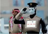  ?? File photo ?? The world’s first interactiv­e operationa­l police robot, employed by the Dubai Police, stands at attention. —