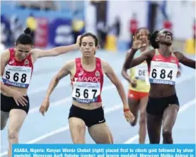  ?? — AFP ?? ASABA, Nigeria: Kenyan Winnie Chebet (right) placed first to clinch gold followed by silver medalist, Moroccan Aarfi Rababe (center) and bronze medalist, Moroccan Malika Akkoui in the Women’s 1500 meter final at the ongoing Africa Athletics Championsh­ip at the Stephen Keshi Stadium in Asaba, Delta State.