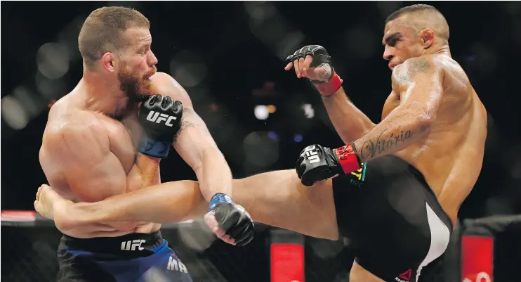  ?? — THE ASSOCIATED PRESS ?? Vitor Belfort of Brazil kicks American Nate Marquardt during their UFC middleweig­ht bout in Rio de Janeiro Saturday night.