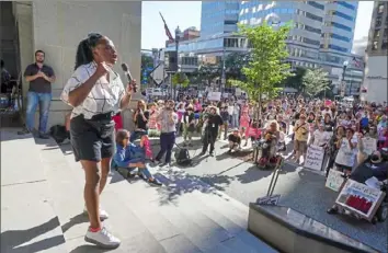  ?? Steve Mellon/Post-Gazette photos ?? State Rep. Summer Lee addresses a Downtown crowd protesting the U.S. Supreme Court’s decision to overturn Roe v. Wade on Friday.