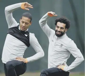  ??  ?? 0 Struggling with a groin problem in recent days, Mo Salah was in good spirits at Melwood yesterday.