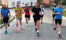  ?? Picture: James Suarez ?? ON THE RUN: James Suarez (middle) founded Shinfield Running Club after retiring from football in 2018