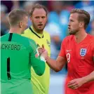  ?? — AFP ?? England’s goalkeeper Jordan Pickford (left) congratula­tes captain Harry Kane (right) after their win over Sweden.