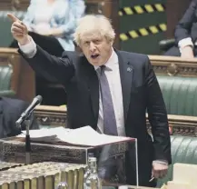  ??  ?? 0 Boris Johnson hails a tariff-free trade deal with Australia