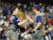 ?? ASSOCIATED PRESS ?? ABOVE: UNITED STATES’ BUSTER POSEY and Luke Gregerson celebrate after the United States defeated Japan, 2-1, in a semifinal in the World Baseball Classic in Los Angeles on Tuesday. RIGHT: United States’ Christian Yelich scores past Japan catcher Seiji...