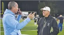  ?? PHOTO BY MARK GILLILAND ?? Lovett coach Mike Muschamp, left, talks with Calhoun coach Hal Lamb before the start of their Nov. 16 game. Lamb has retired.