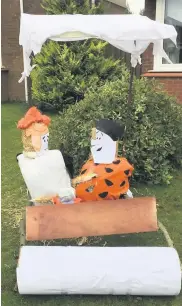  ??  ?? Prehistori­c pair Fred and Wilma Flintstone’s scarecrows pick up second place