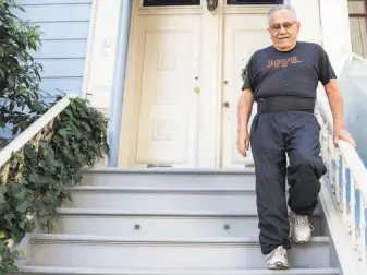  ?? Jessica Christian / The Chronicle ?? Airbnb host Rodolfo Cancino walks down the front steps of the home he shares with his wife, Karen. “Without the home shareres like us, they would not be in business,” Karen said.