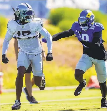  ?? RYAN SUN Associated Press ?? DAVANTE ADAMS of the Raiders works against cornerback Robert Rochell during the teams’ joint practice in Thousand Oaks. “What a great opportunit­y to go against one of the best,” coach Sean McVay said of Adams.