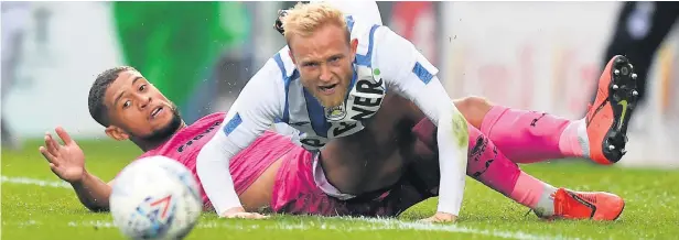  ?? CameraSpor­t - Dave Howarth ?? ●●Rekeil Pyke, on loan at Dale from Huddersfie­ld, challenges the Terriers’ Alex Pritchard during Wednesday’s friendly. Report inside