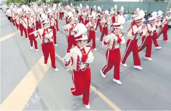  ??  ?? Klamath Union High School marching band, from Klamath, Oregon, participat­es in last year’s Island Farms Victoria Day Parade. The parade takes place Monday, starting at 9 a.m. from Mayfair Mall, and runs along Douglas Street to the corner of Humboldt...