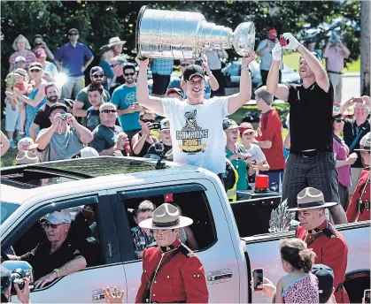  ?? CANADIAN PRESS FILE PHOTO ?? Pittsburgh Penguins’ Sidney Crosby hoists the Stanley Cup during a parade through his hometown of Cole Harbour, N.S., on July 16, 2016.