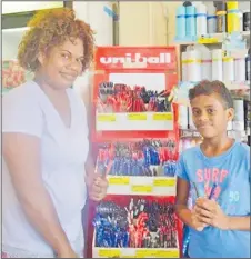  ?? Picture: SUPPLIED ?? Adi Mela and Tulia Vulivuli of Vatuwaqa with Uni-ball pens at Shop N Save in Nabua.