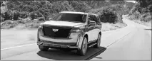  ?? COURTESY OF GENERAL MOTORS VIA AP ?? This 2021 Cadillac Escalade offers a standard V8 engine and enormous digital display screens.