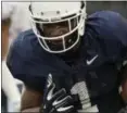  ?? MICHAEL MCANDREWS — HARTFORD COURANT VIA AP ?? UConn’s Hergy Mayala scores a touchdown during the first half Friday.