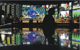  ?? John Locher / Associated Press ?? A wall of screens at the Westgate Superbook sports book in Las Vegas. How we watch sports is undergoing a shift as viewers drop cable for streaming options.