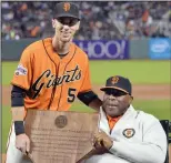  ?? DOUG DURAN/TRIBUNE NEWS SERVICE ?? The San Francisco Giants' Matt Duffy, left, and Willie McCovey after Duffy won the annual Willie Mac Award before tthe start of the Giants' game against the Colorado Rockies at AT&amp;T Park in San Francisco on Nov. 2, 2015.