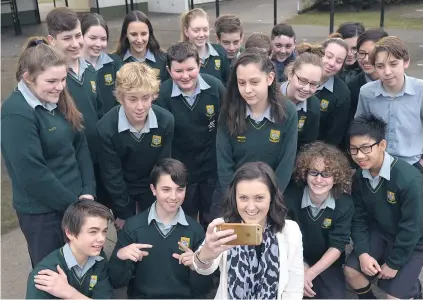  ?? PHOTO: GERARD O’BRIEN ?? In the picture . . . University of Otago marketing department profession­al practice fellow Leanne Ross takes a selfie with Bayfield High School pupils after giving a talk about social media safety.