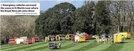  ?? Picture: Hugh Hastings/Getty ?? Emergency vehicles surround the scene in St Martin near where the Royal Navy jet came down