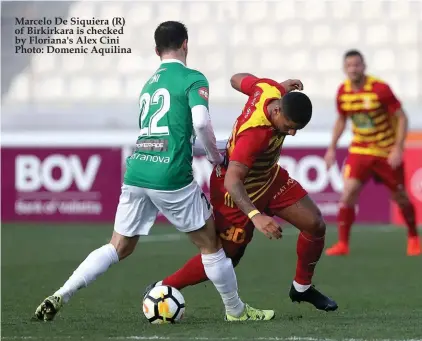  ?? Photo: Domenic Aquilina ?? Marcelo De Siquiera (R) of Birkirkara is checked by Floriana's Alex Cini