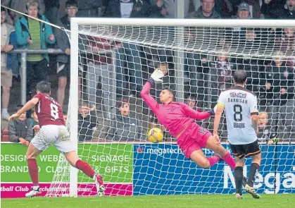  ??  ?? Arbroath’s Michael Mckenna scores his second of the game to put the Lichties in front