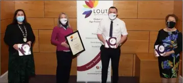  ??  ?? Sharon Fitzgerald and Stephen Arrowsmith from Specsavers receiving their award from Chair of Dundalk Municipal District, Cllr Emma Coffey and Colette Moss, Economic Developmen­t, Louth County Council at the Age Friendly Business Award Ceremony.