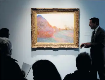  ?? REUTERS ?? A PAINTING by Claude Monet, part of the Haystacks Les Meules series, is displayed at Sotheby’s during a... May 15, 2019.