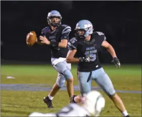  ?? GENE WALSH/FOR MEDIANEWS GROUP ?? North Penn quarterbac­k Ryan Zeltt looks to pass against Pennridge on Friday night.