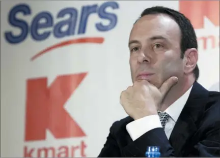  ?? GREGORY BULL — THE ASSOCIATED PRESS FILE ?? Edward Lampert listens during a news conference to announce the merger of Kmart and Sears in New York. As Sears teeters on the brink of collapse, there’s one man at the center of the fight for the future of the iconic retailer. Lampert plays several, often conflictin­g, roles in what could be the final chapter for the company that began as a mail order watch business 132 years ago. He’s been chairman, CEO, landlord, lender, and largest shareholde­r all at the same time. If the company survives, he wins. If it ends up liquidatin­g, he also wins.