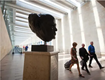  ?? (Moshe Shai/Flash90) ?? ‘IMPROPER TO define being a Jew’: A bust of David Ben-Gurion stands sentry over the airport departure hall.