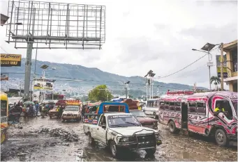  ??  ?? Leogane portail, at one end of the Grand’ Rue, leads to one of two main highways out of Port-au-Prince.