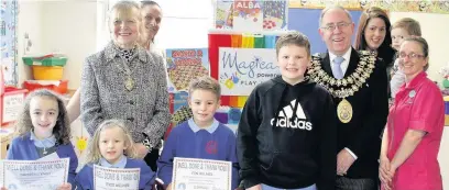  ??  ?? ●●At the presentati­on are, back row from left, Mayoress Dr Margaret Gordon, Val Jackson from Action for Sick Children, Mayor Coun Chris Gordon, Jack Dixon with mum Katie, and play specialist Caroline Oates. Front: Imogen Lynch, Evie Milner and Fin...