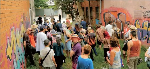  ??  ?? Members of Urban Coup tour the site of their planned co-housing project in Melbourne, Australia. — Reuters