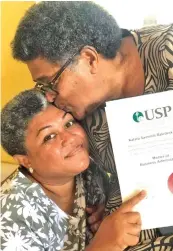  ?? ?? Kalara Thomas Baledrokad­roka (left) is being congratula­ted by her mother, Mereseini Thomas.