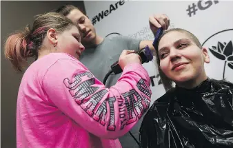  ?? TYLER BROWNBRIDG­E ?? Daughter Nevaeh shaves her mother Tabitha’s head during an “empowermen­t party” the day before her mom was to start chemothera­py. Just over a year later, Tabitha’s hair is slowly growing back.