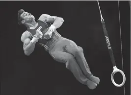  ?? ASSOCIATED PRESS ?? SAM MIKULAK COMPETES on the rings at the U.S. Gymnastics Championsh­ips on Saturday in Boston.