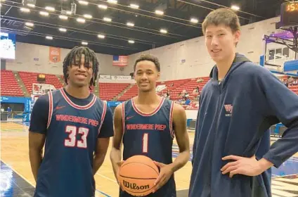  ?? BUDDY COLLINGS/ORLANDO SENTINEL ?? Windermere Prep junior Chandler Watts, left, and freshman teammates Brandon Bass Jr., center, and Sinan Huan played key roles for the Lakers in their FHSAA Class 3A state semifinal win Wednesday against Providence School at RP Funding Center in Lakeland.