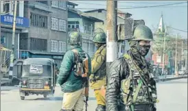  ?? PTI ?? CRPF personnel stand guard during restrictio­ns imposed to thwart any possible protest called by separatist­s over civilian killings in Pulwama, in Srinagar on Sunday,