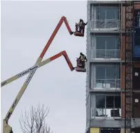  ?? STEVE RUSSELL TORONTO STAR FILE PHOTO ?? Although 29,000 new condos were scheduled for occupancy this year, 20,000 is probably more realistic, Urbanation says.