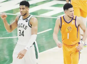  ?? ap ?? Giannis Antetokoun­mpo, a la izquierda, y Devin Booker, a la derecha, volverán esta noche a verse las caras, cuando la final está nivelada a dos juegos.