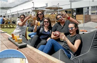  ?? ROSA WOODS/STUFF ?? Enjoying a drink in the sun at Brewtown are, from left, Anau Tangi, Laine Hewson, Rebecca Lyons, Julia Peel and Kristina Elfstrom.