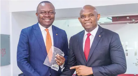  ??  ?? Chief Executive Officer, Transcorp Hotels Plc, Valentine Ozigbo, presenting The PEARLS Award for Sectoral Leader in the Nigerian Capital Market for Services (Hotels Sector). won by the Transcorp Hotels Plc to, the Chairman of Transcorp Plc owners of...