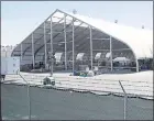  ?? NHAT V. MEYER STAFF ARCHIVES ?? Tesla set up this tent at its Fremont location in June to boost production as the automaker struggled to meet goals on its Model 3 cars.