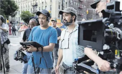  ??  ?? Jon M. Chu y Lin-Manuel Miranda, en el rodaje de ‘En un barrio de Nueva York’.