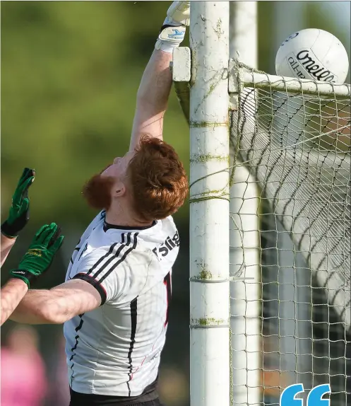  ??  ?? Aidan Devaney of Sligo watches a ball go over the bar for a point under pressure form James McEntee of Meath. Pics: Piaras Ó Mídheach/SPORTSFILE.