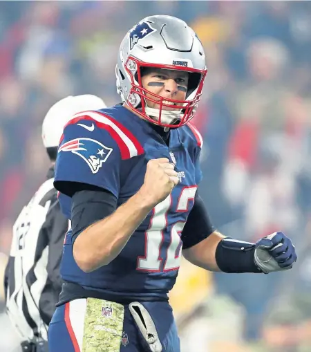  ?? NANCY LANE / BOSTON HERALD ?? YES: Tom Brady reacts during the Pats’ win over the Packers last night.