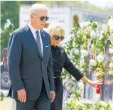  ?? PHOTO / AP ?? President Joe Biden and first lady Jill Biden visit a memorial at Robb Elementary School to pay their respects to the victims of the mass shooting.